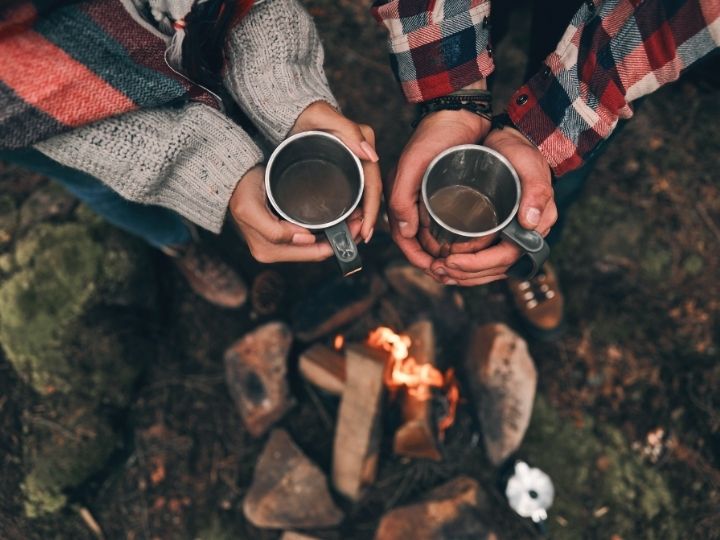 having a warm drink on a romantic hike